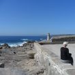 Mux&iacute;a. Idem, nu met de vuurtoren en in de verte Cabo Villano